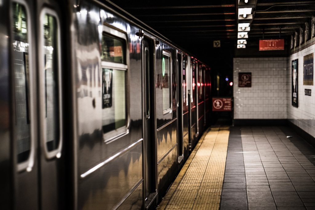 photo of a shiny subway car at an empty platform
