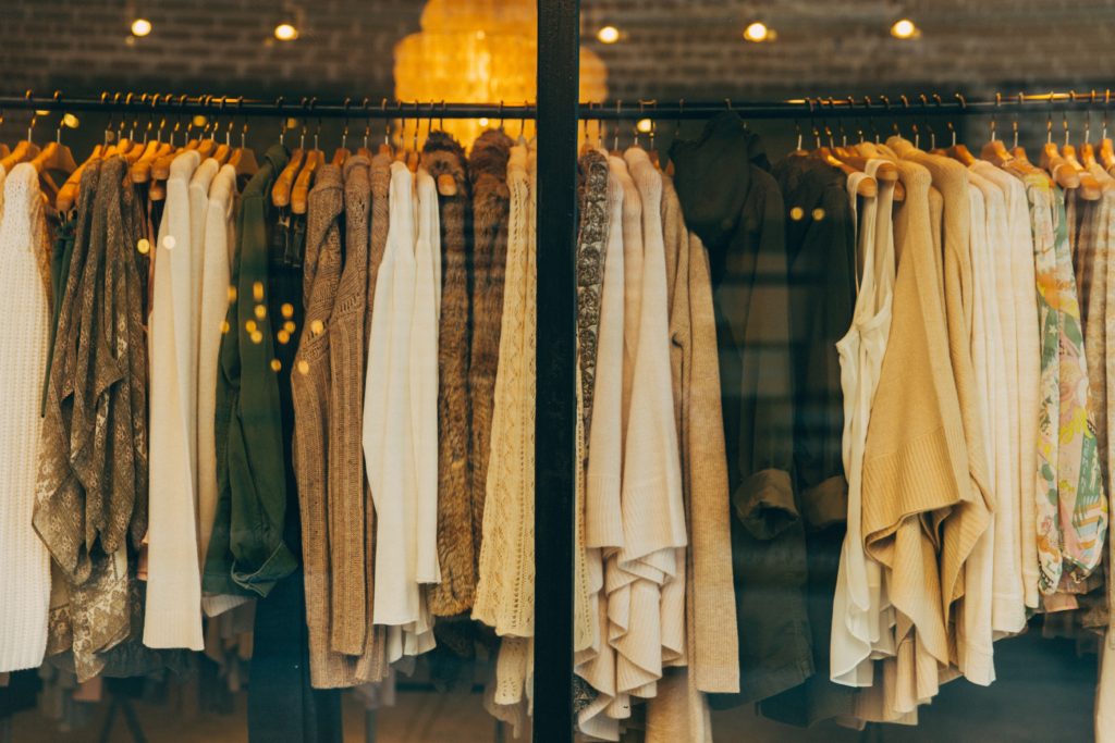 photo of a rack of clothing in subdued colors